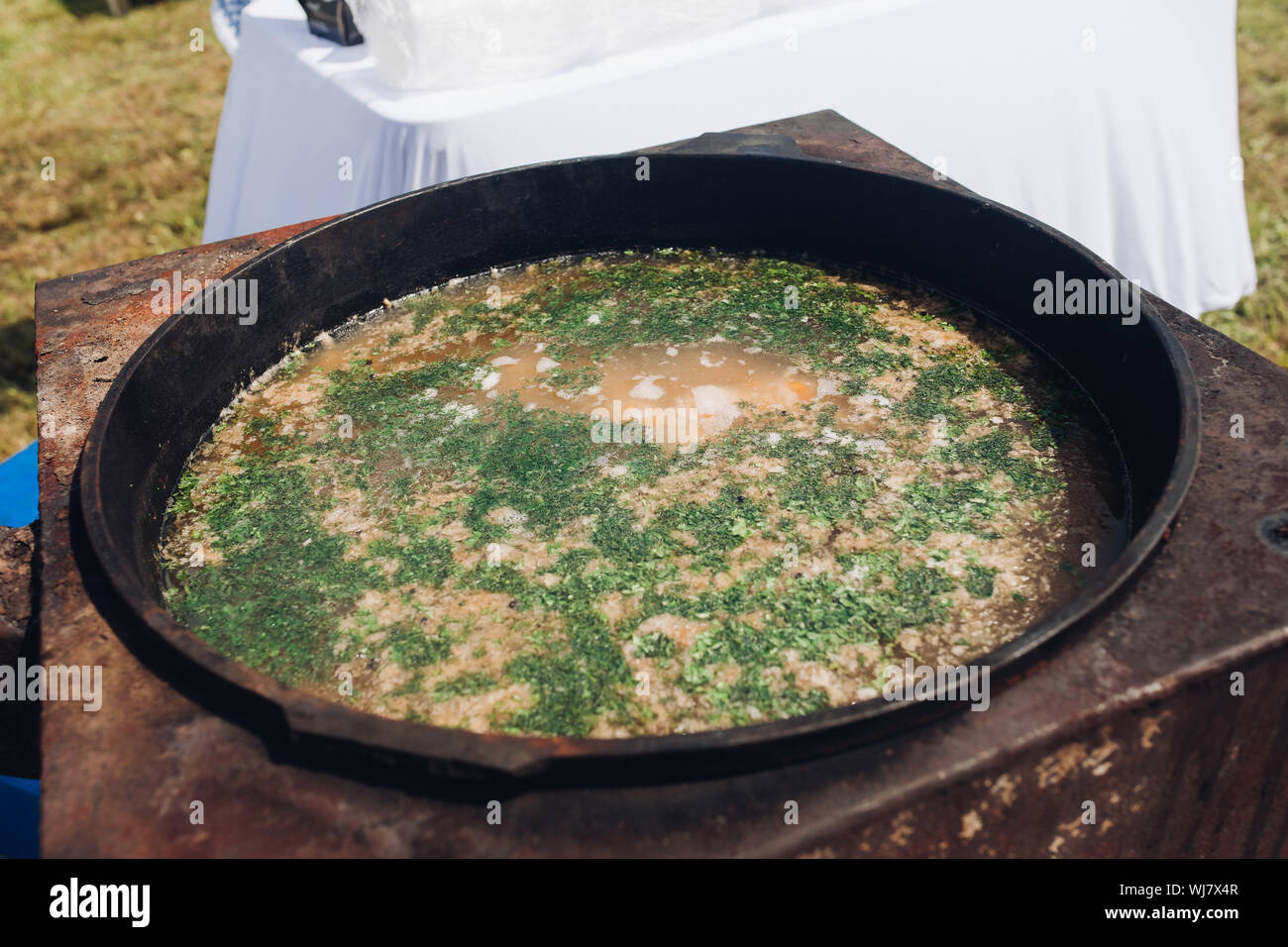 Cauldron of delicious soup outdoors Stock Photo Alamy