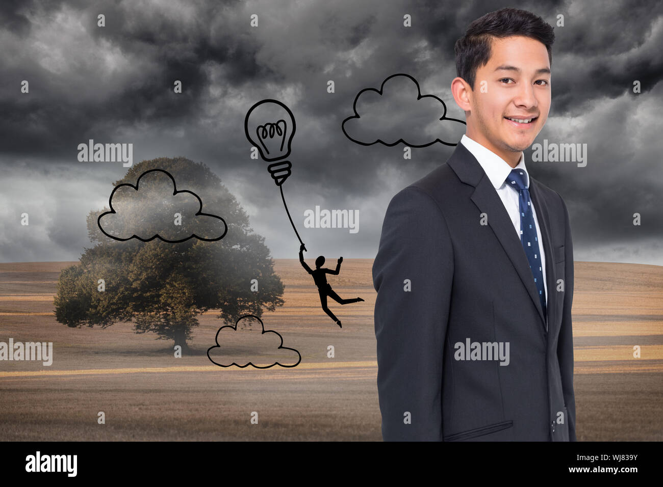 Composite image of light bulb balloon over cloudy landscape Stock Photo