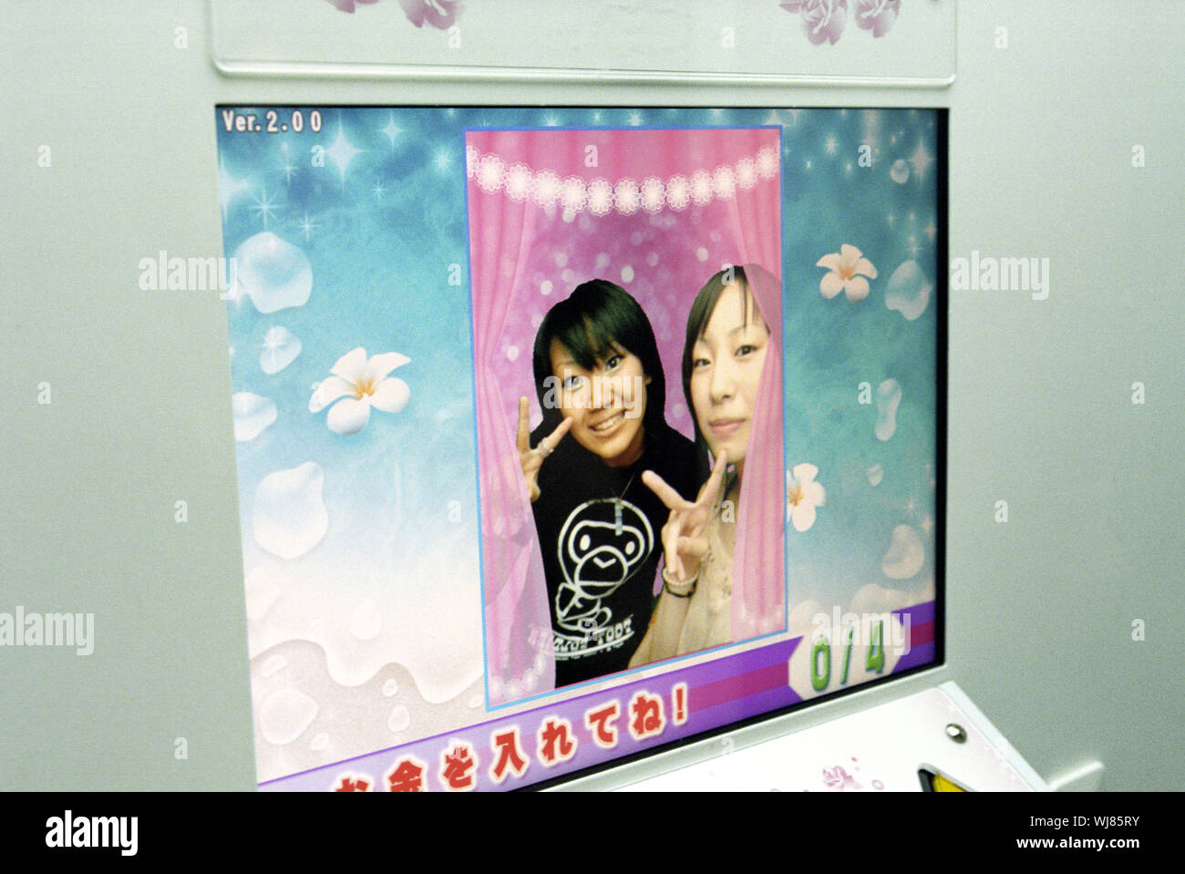 Two Japanese in a photo booth, Shibuya Distric, Tokyo, Japan. Stock Photo