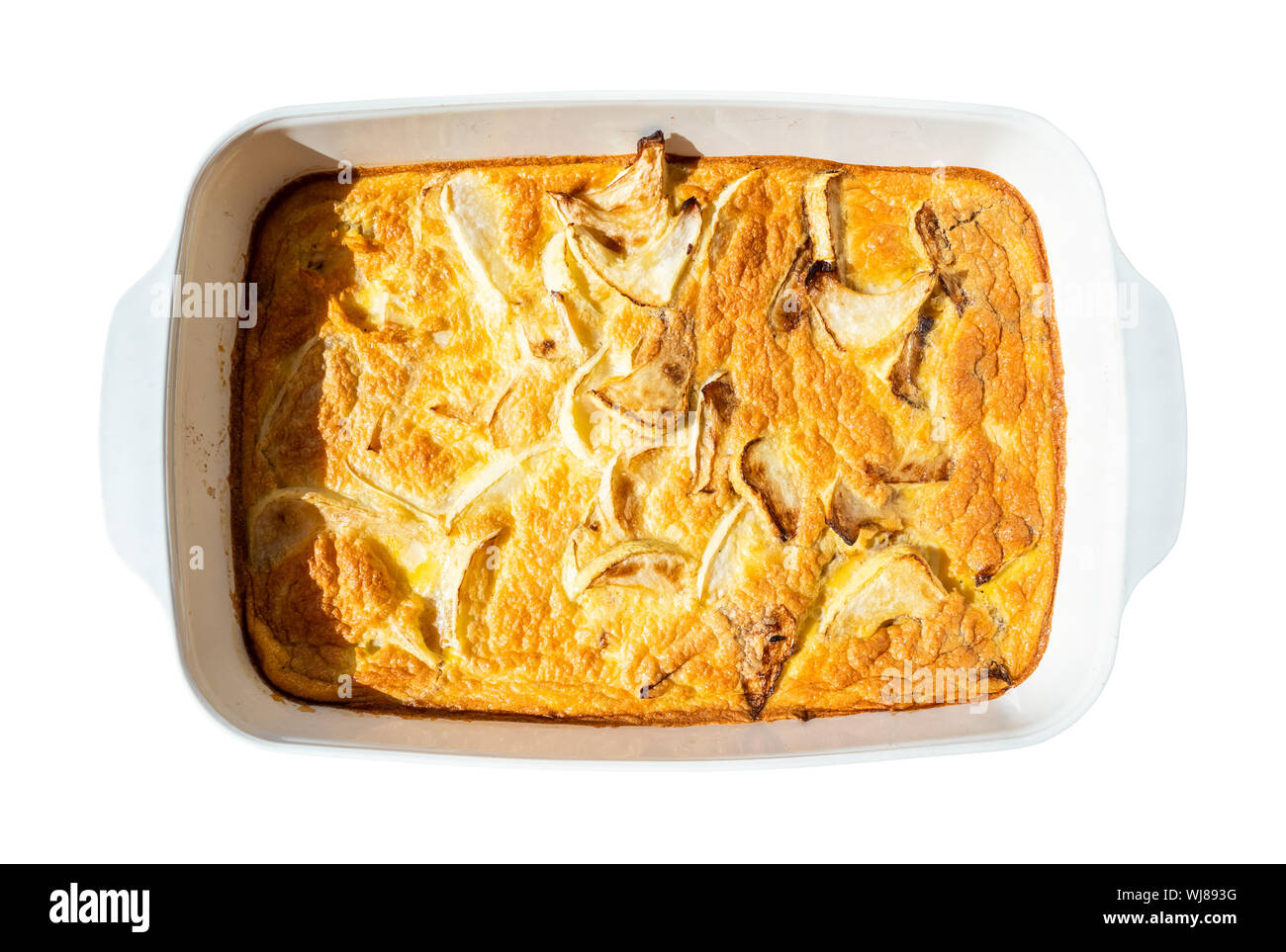french cuisine - top view of baked omelette with white squash vegetable in ceramic baking dish cutout on white background Stock Photo