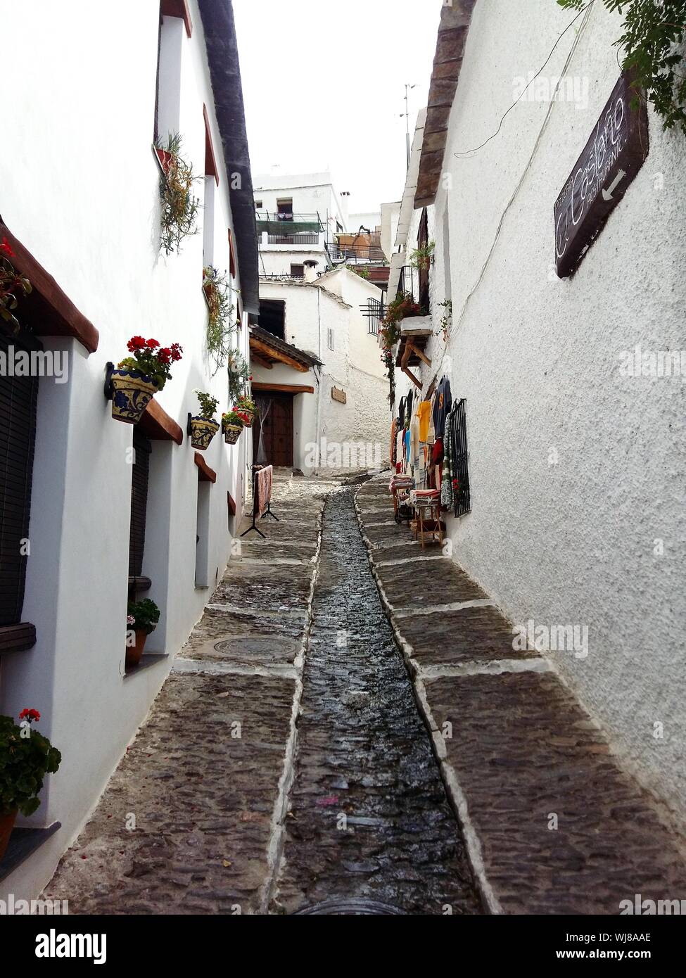 Alley Amidst Buildings At Alpujarras Stock Photo