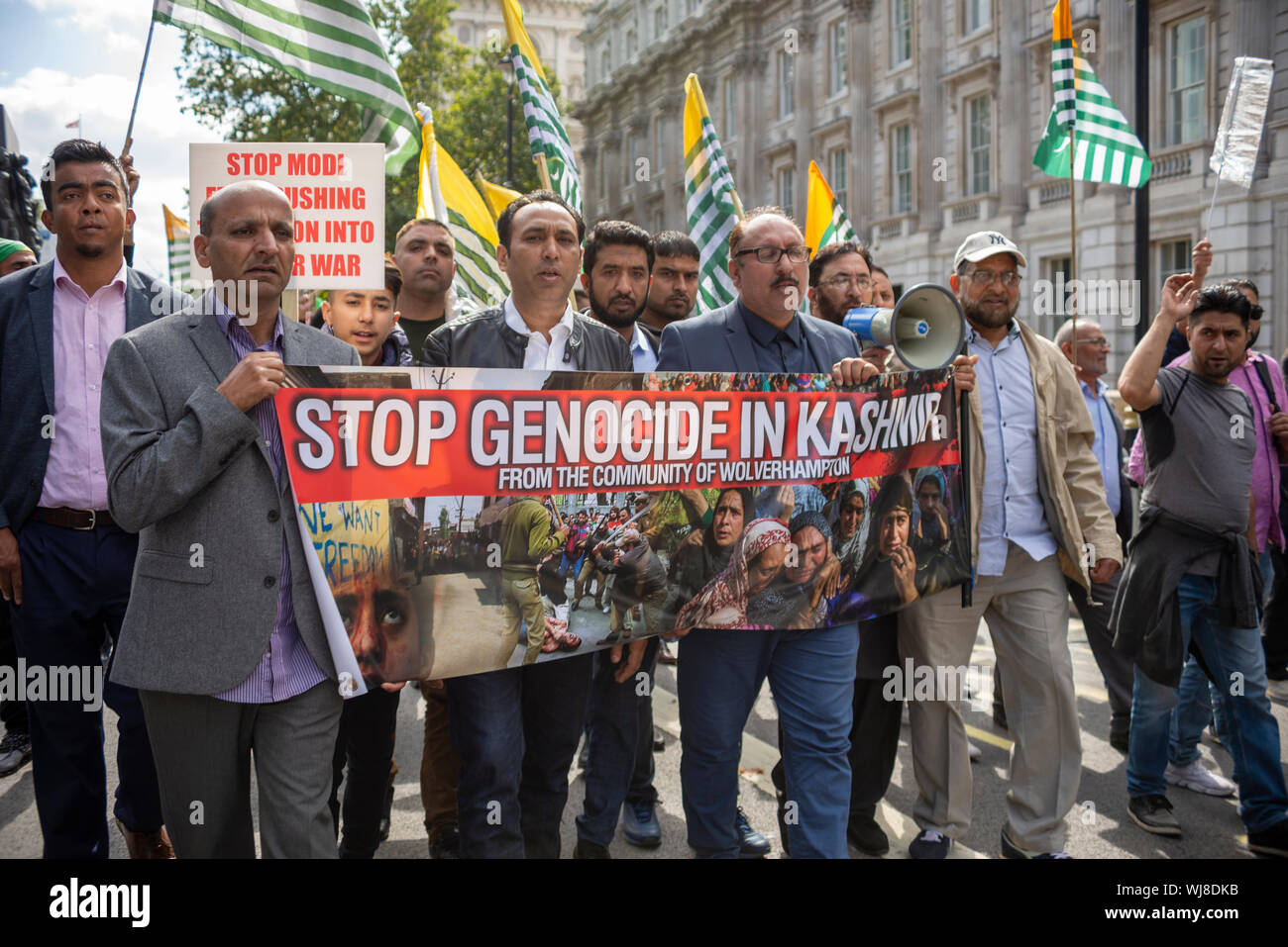 A protest is taking place in Westminster, London, UK demonstrating against the Indian occupation of Jammu and Kashmir, claiming that thousands have been killed and injured by the Indian armed forces. On 5th August Article 370 – which protected the rights of the population of the area – was revoked by the BJP government Stock Photo
