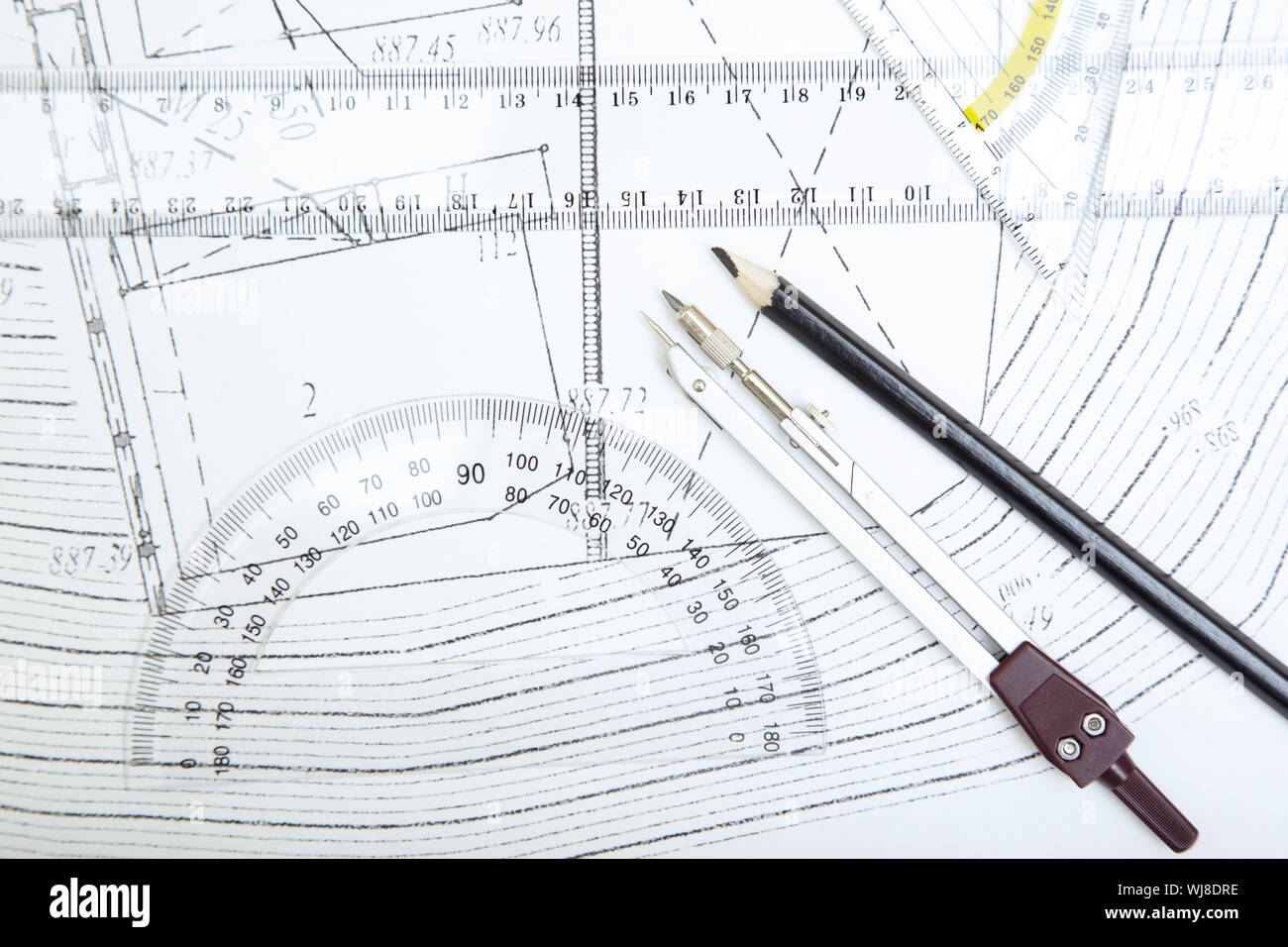 Rules Compasses Scheme with compasses rulers and pencil. Close-up photo Stock Photo - Alamy