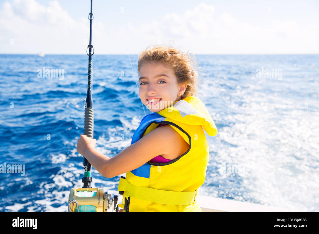 Children fishing boat life jacket hi-res stock photography and