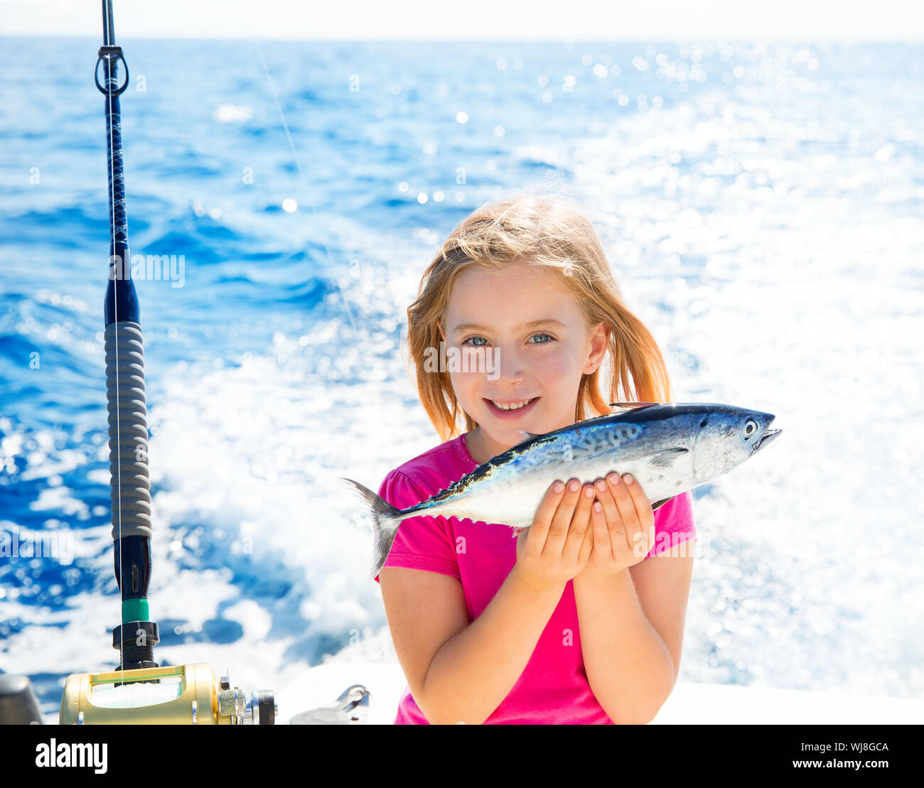 Girl holding fish fishing rod hi-res stock photography and images - Page 2  - Alamy