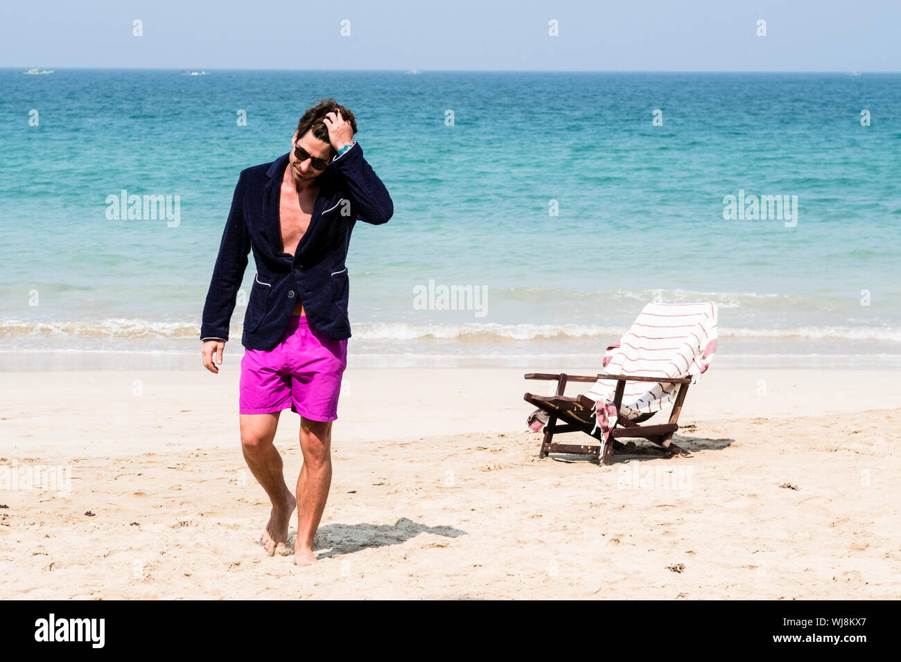 Man walking on beach hi-res stock photography and images - Alamy