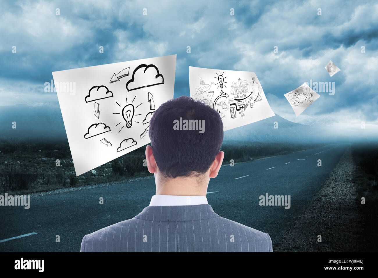 Composite image of businessman standing Stock Photo