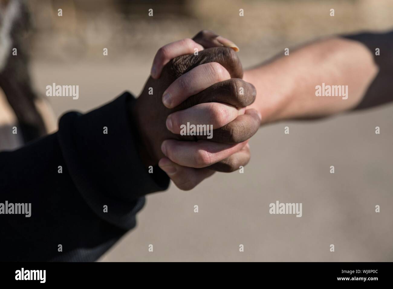 Close-up Of Hands Gripping Stock Photo