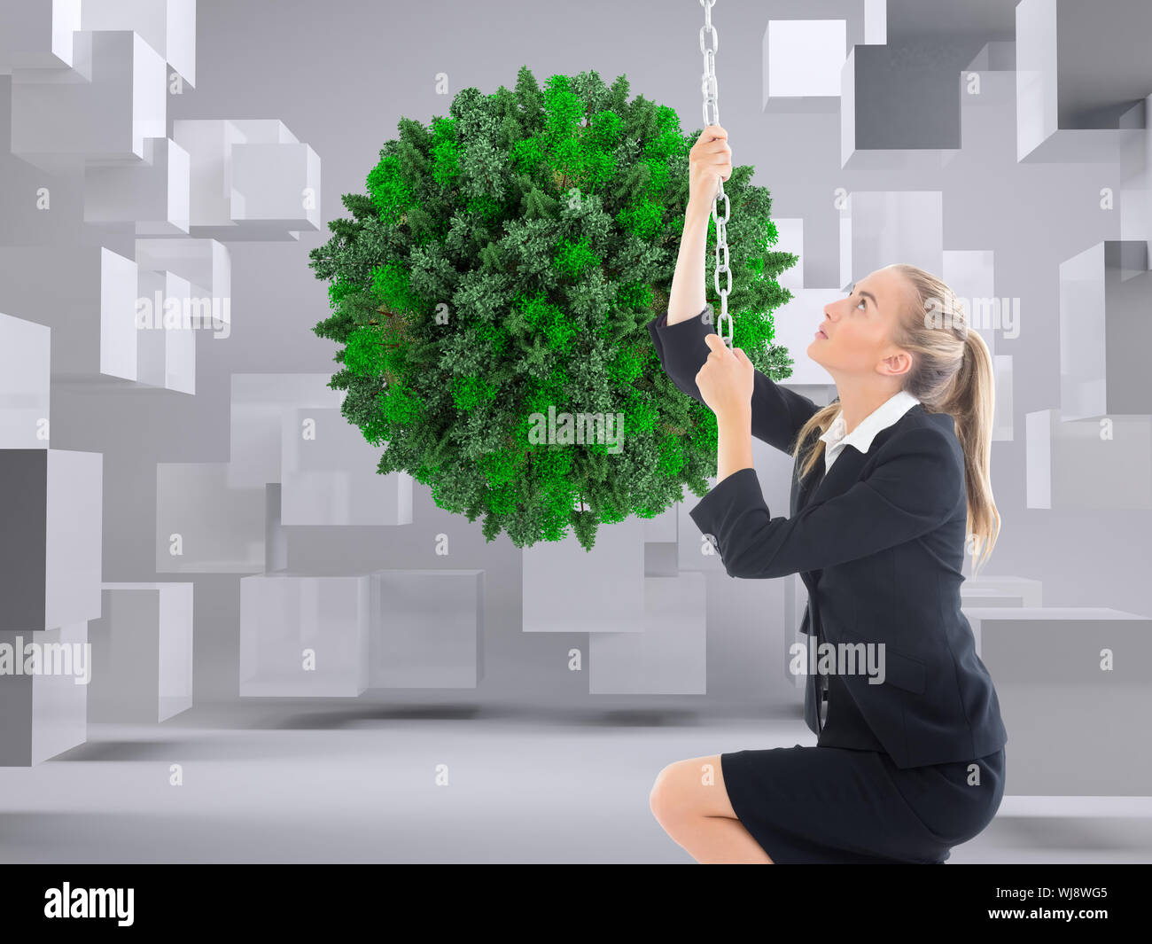 Composite image of blonde businesswoman pulling a chain Stock Photo - Alamy