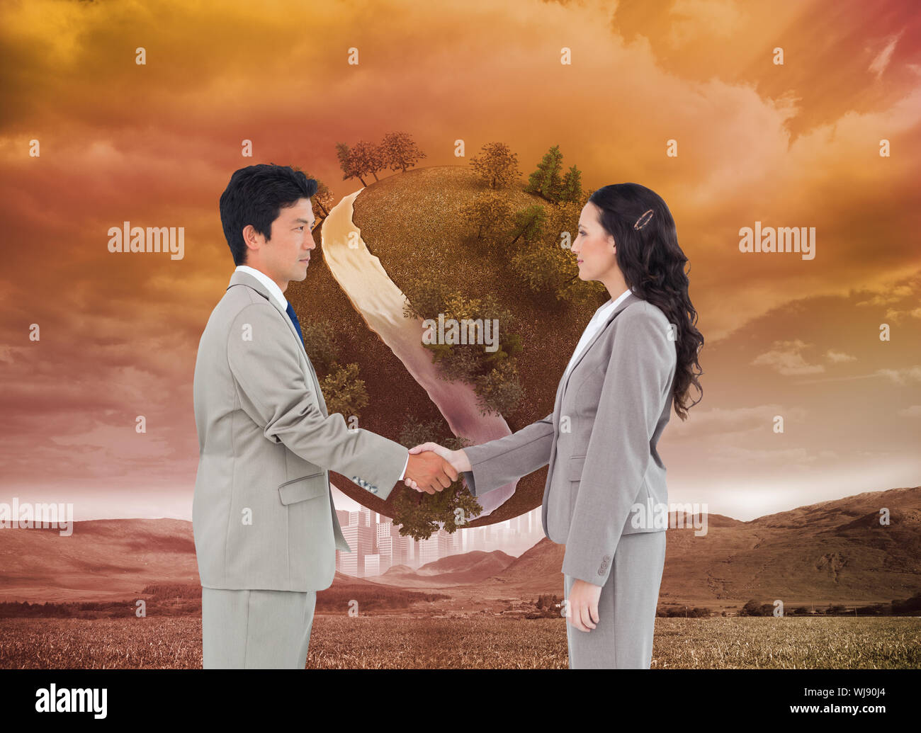 Composite image of side view of hand shaking trading partners against a white background Stock Photo