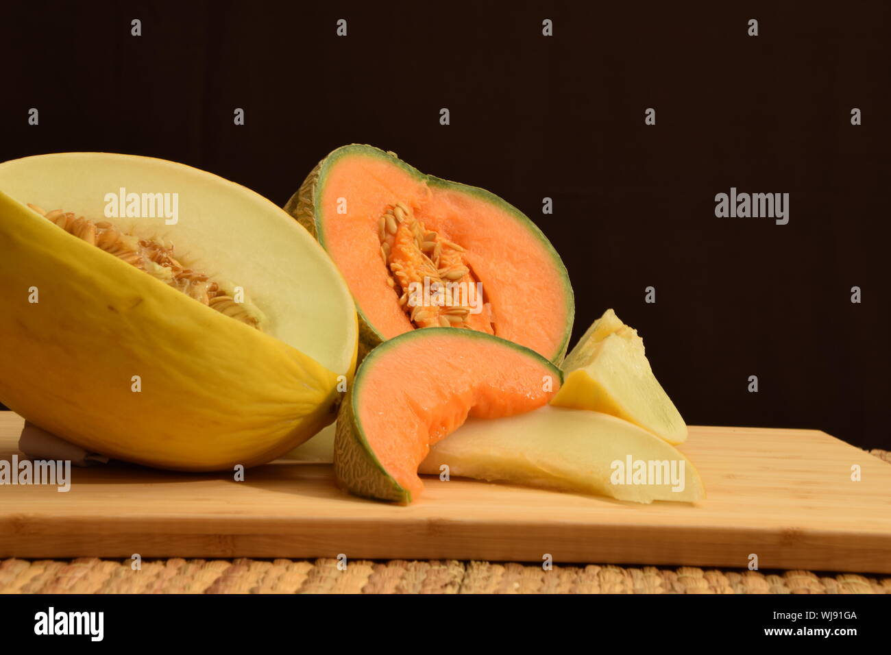 Ensemble of honeydew melon and cantaloup on dark background Stock Photo
