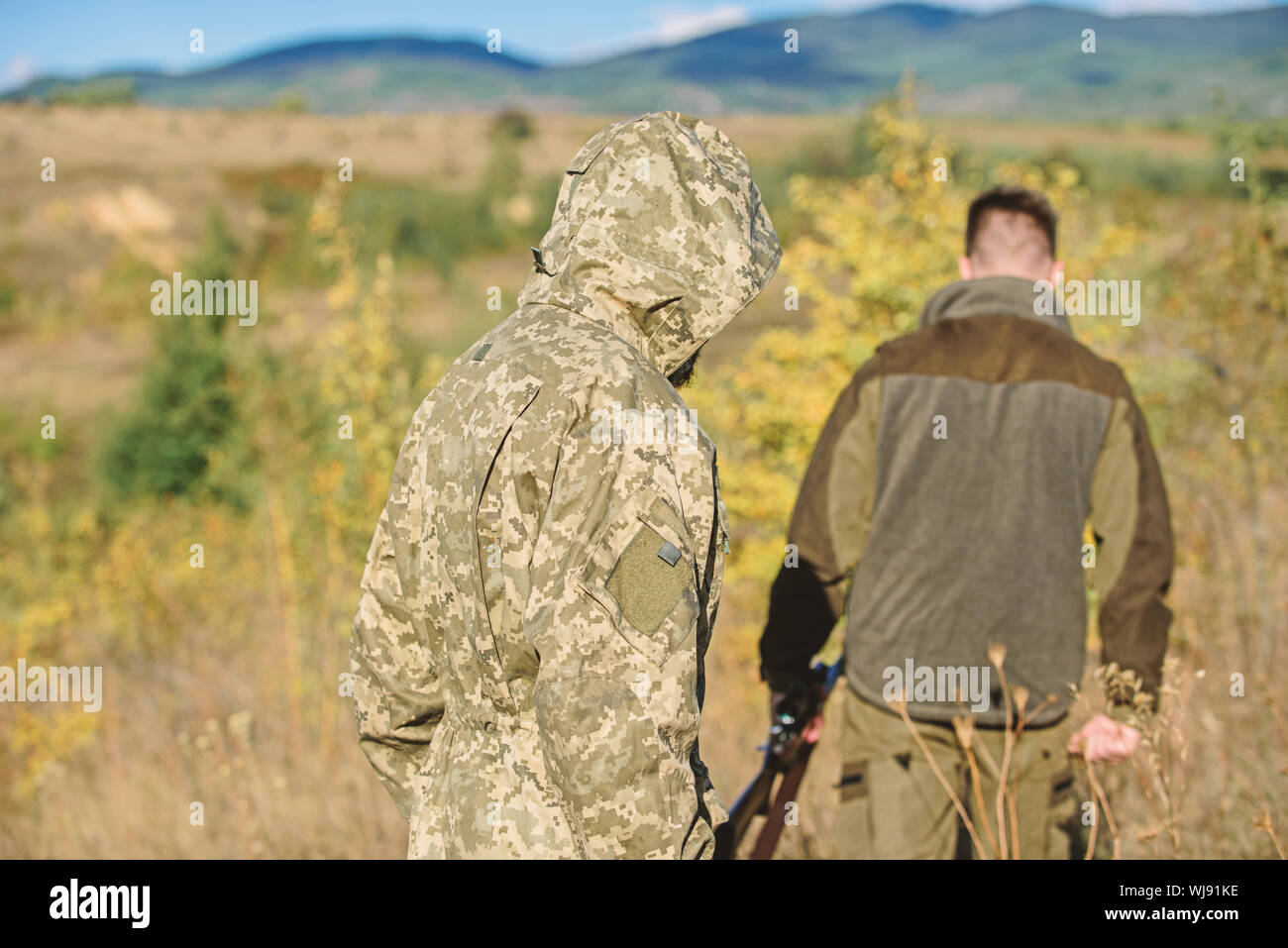 Activity for brutal men. Hunters poachers looking for victim. Poachers with  rifles in nature environment. Illegal hunting. Hunters brutal poachers.  Forbidden hunting. Breaking law. Poaching concept Stock Photo - Alamy