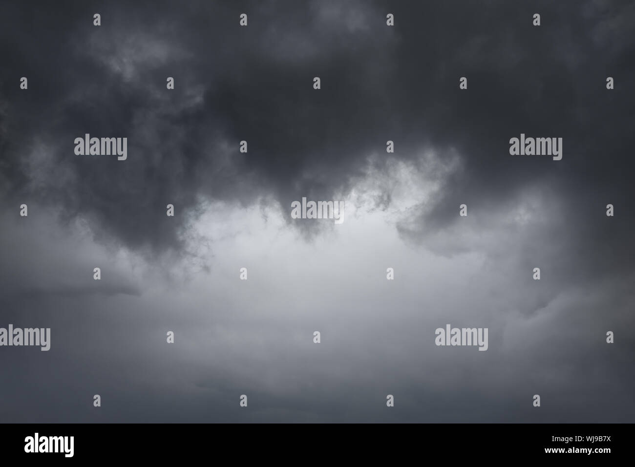 cloudscape background of dark stormy clouds Stock Photo - Alamy