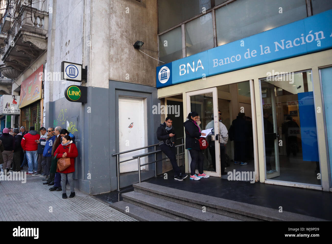 BUENOS AIRES, 03.09.2019: Hundreds of savers go to the banks' doors to withdraw their savings due to the fear of financial insolvency of the banking s Stock Photo