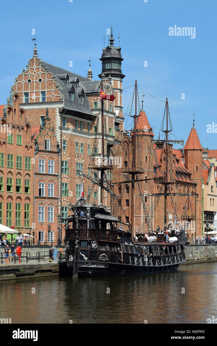 Cityscape of Gdansk at the river Motlawa with Old sailing ship - Poland. Stock Photo
