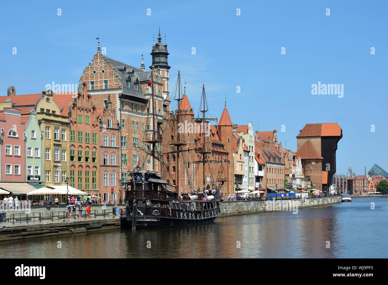 Cityscape of Gdansk at the river Motlawa with Old sailing ship and Crane gate - Poland. Stock Photo