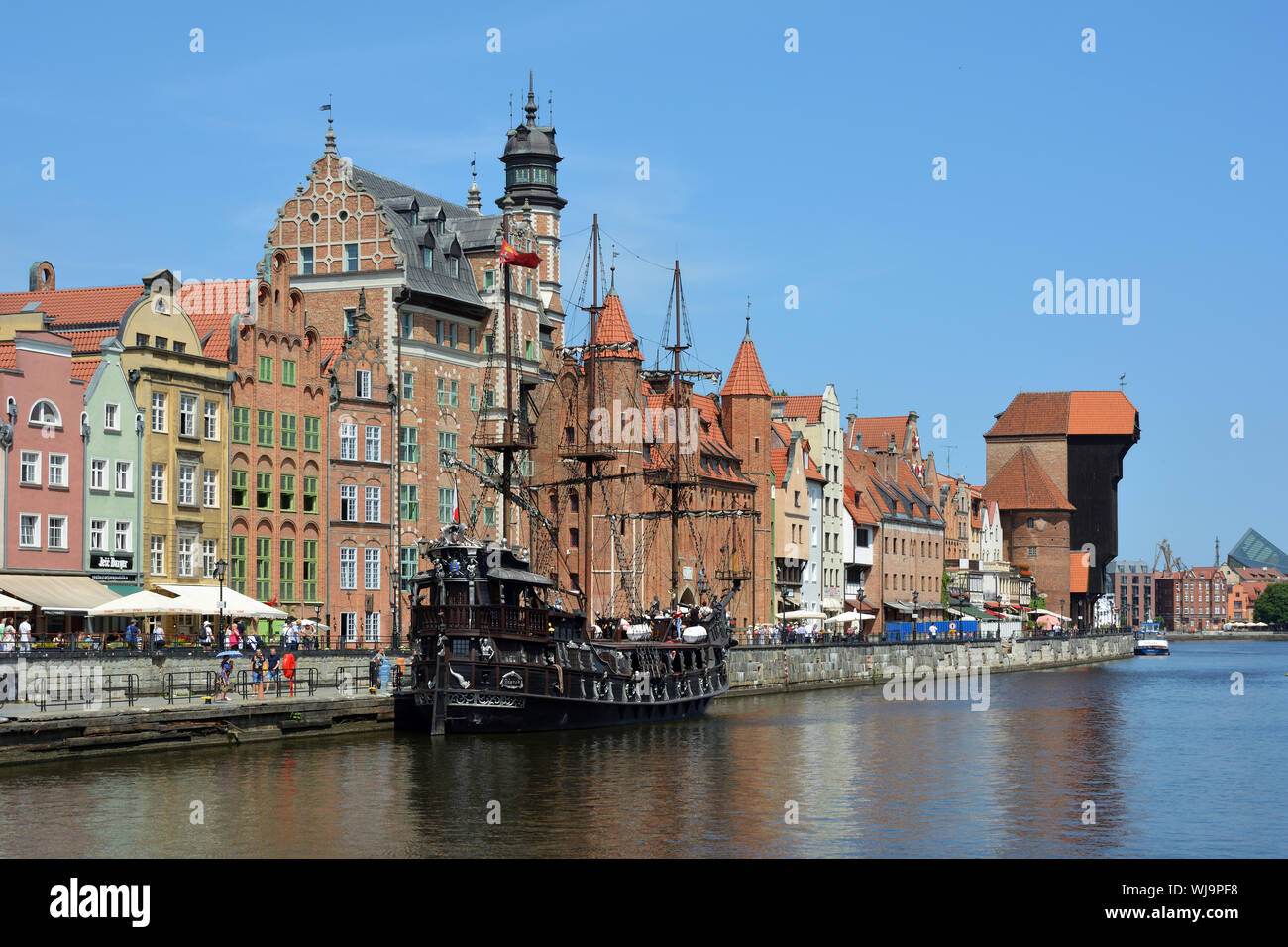 Cityscape of Gdansk at the river Motlawa with Old sailing ship and Crane gate - Poland. Stock Photo