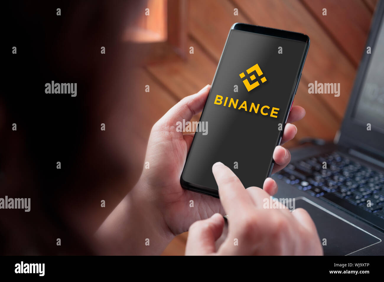 Bangkok, Thailand - Septempber 3, 2019: Hand holding smartphone with  Binance logo on screen. Binance is a global cryptocurrency exchange that  provides Stock Photo - Alamy