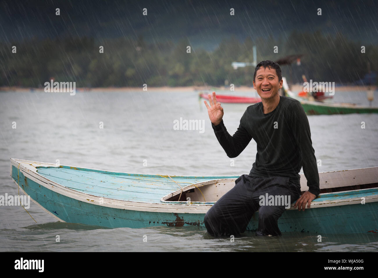 Indian man sitting on boat hi-res stock photography and images - Alamy