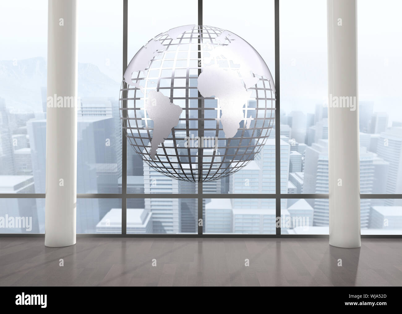 Silver globe floating in room Stock Photo