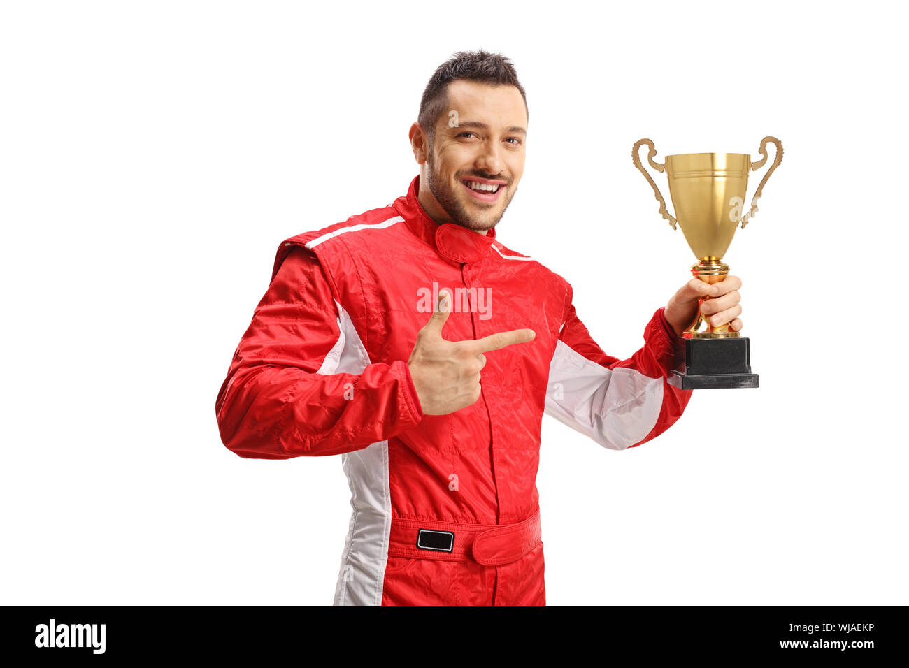Car racer winner holding a gold trophy cup and pointing at it isolated on white background Stock Photo