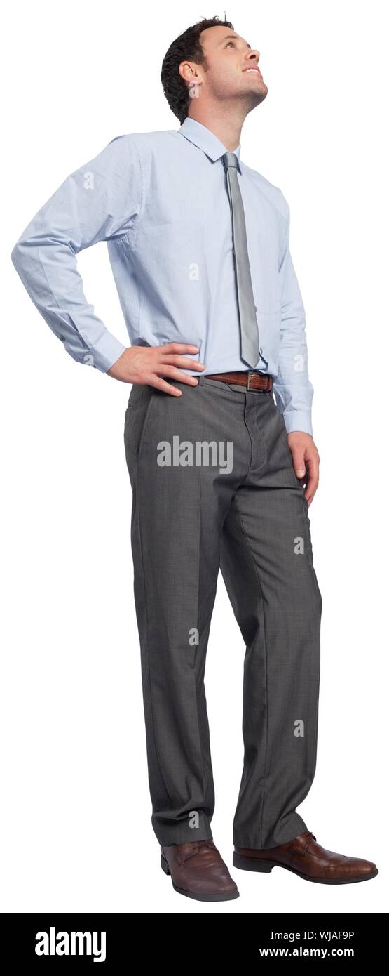 Smiling businessman with hand on hip Stock Photo