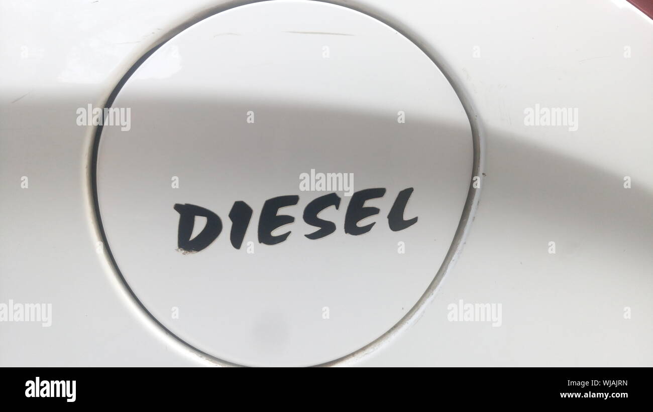 Close-up Of Text On Gas Tank Of Car Stock Photo