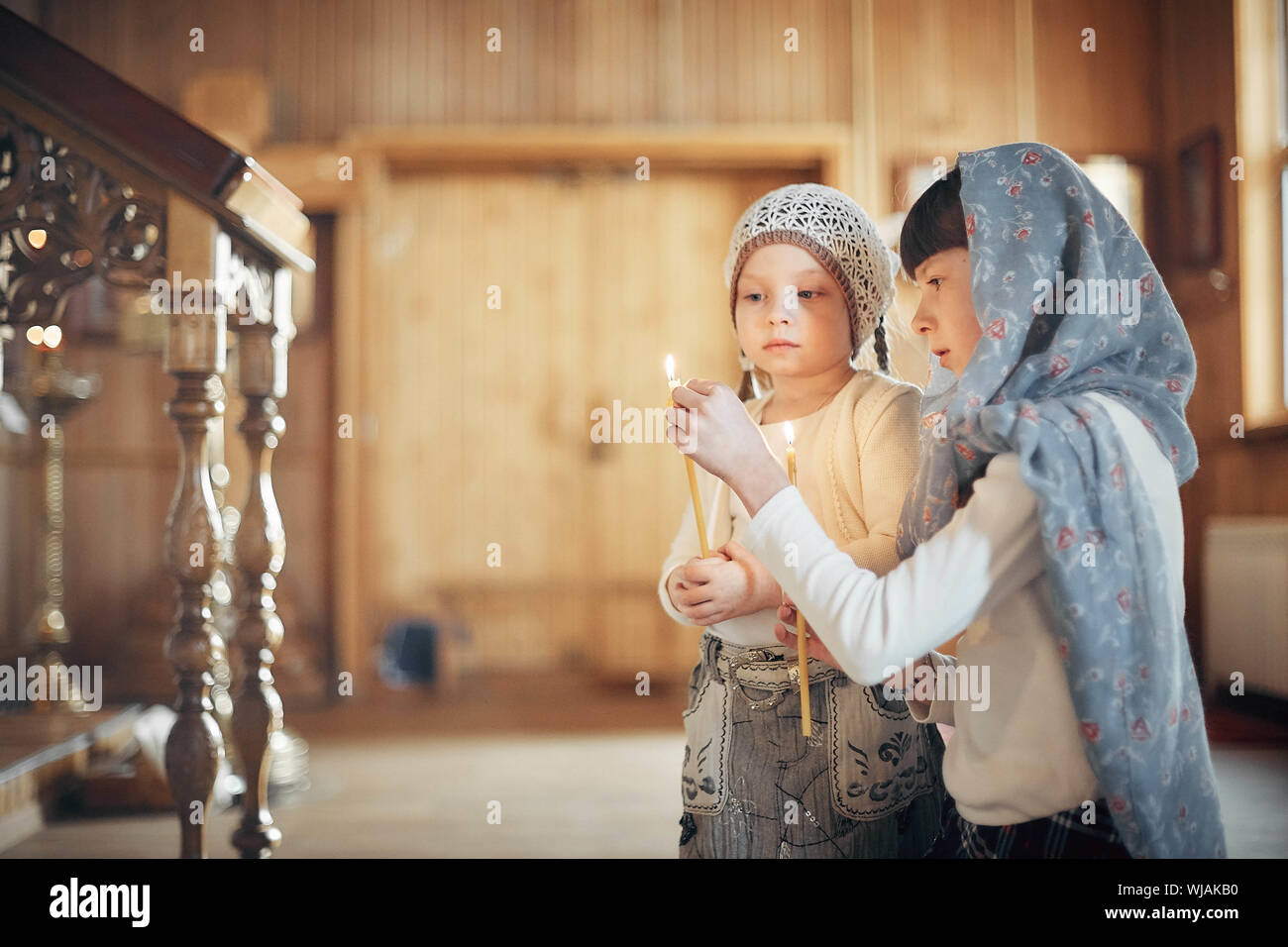 Two Russian women in winter clothes against Orthodox monastery