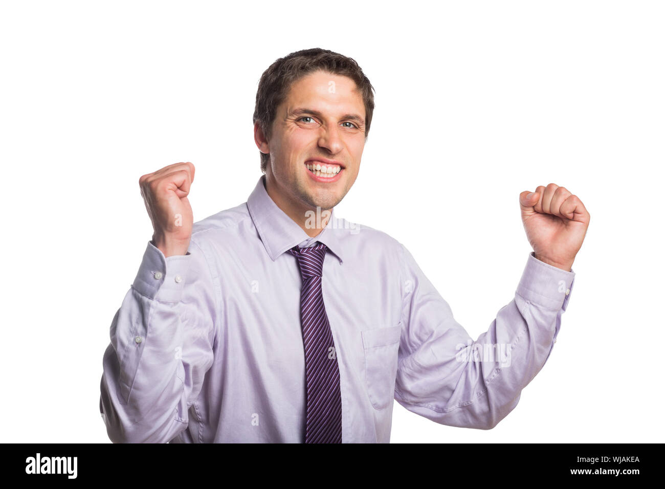 Portrait of a cheerful young businessman cheering Stock Photo