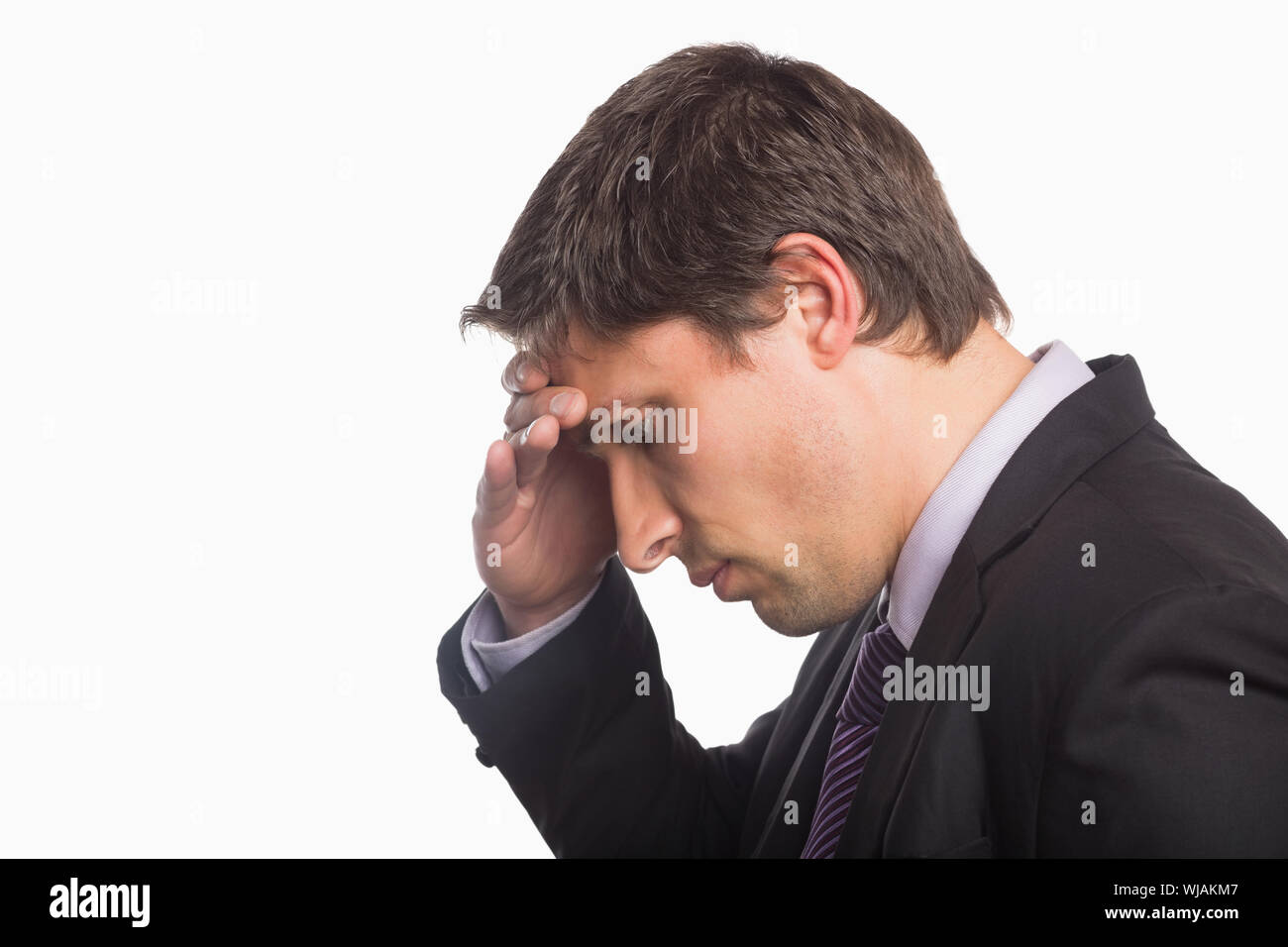 Close-up side view of a worried businessman Stock Photo