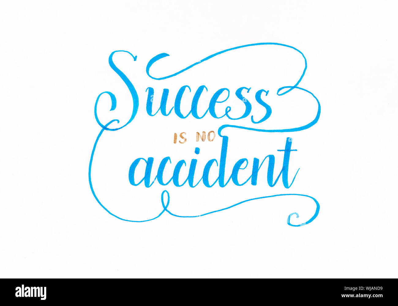 'Success is no accident' inspirational hand lettering inscription in blue Stock Photo
