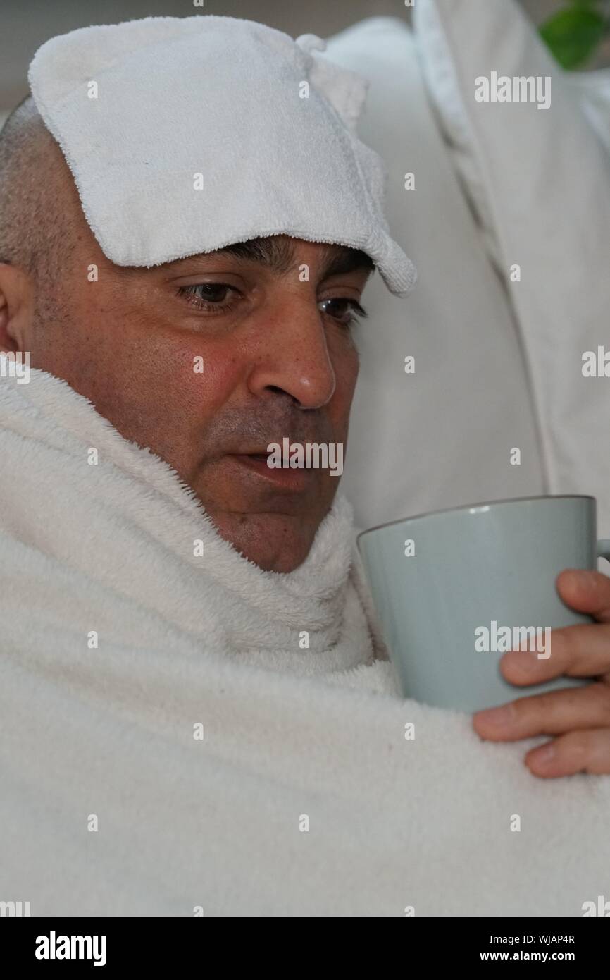 Sick Man Having Coffee At Home Stock Photo Alamy