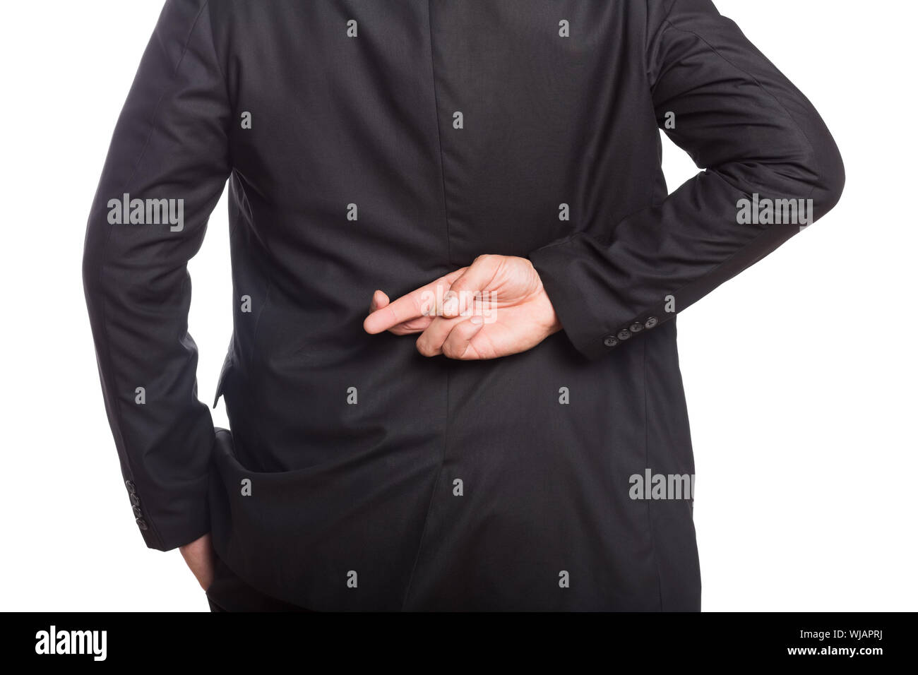 Mid section of a businessman with crossed fingers Stock Photo