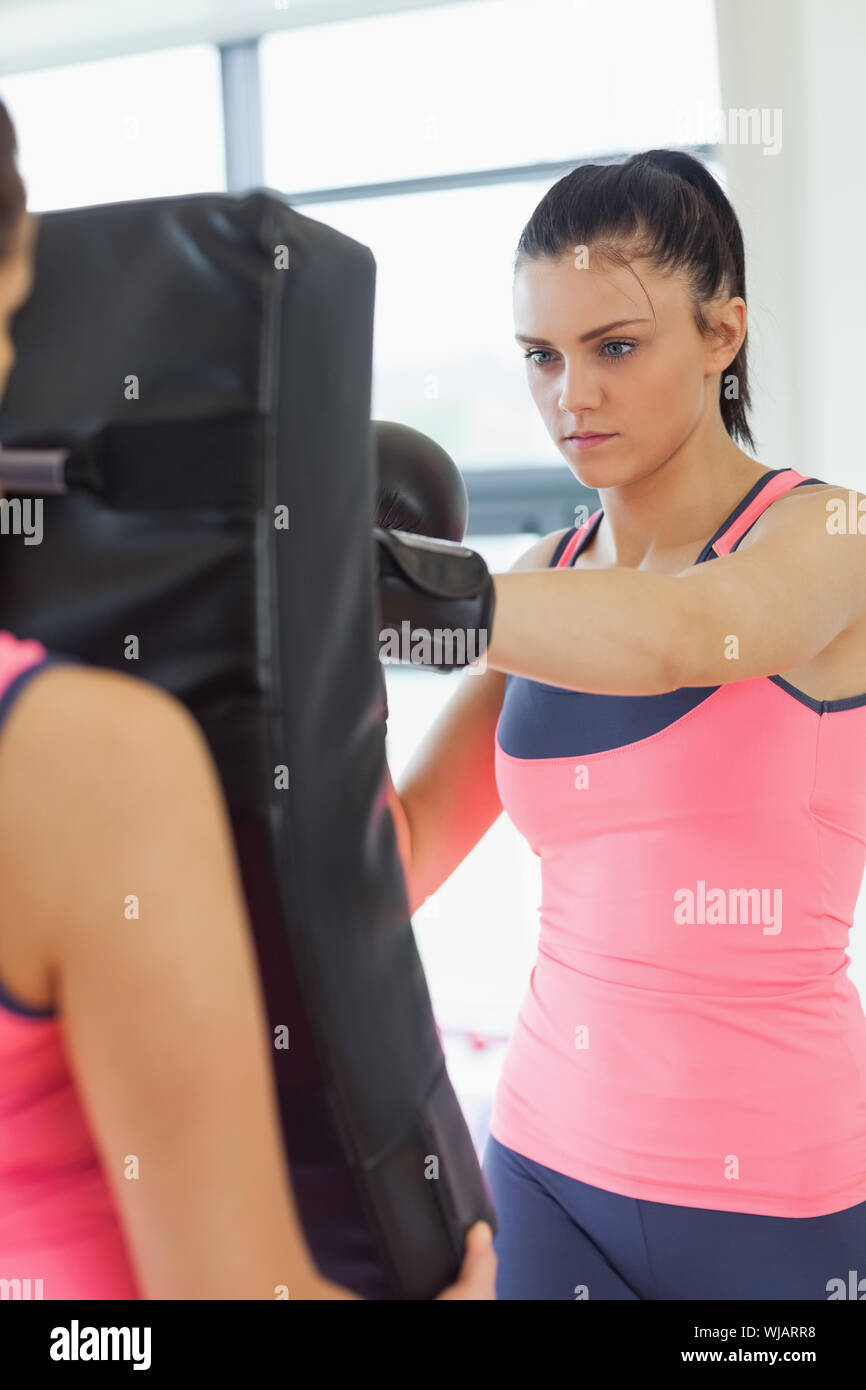 Determined female boxer focused on her training Stock Photo