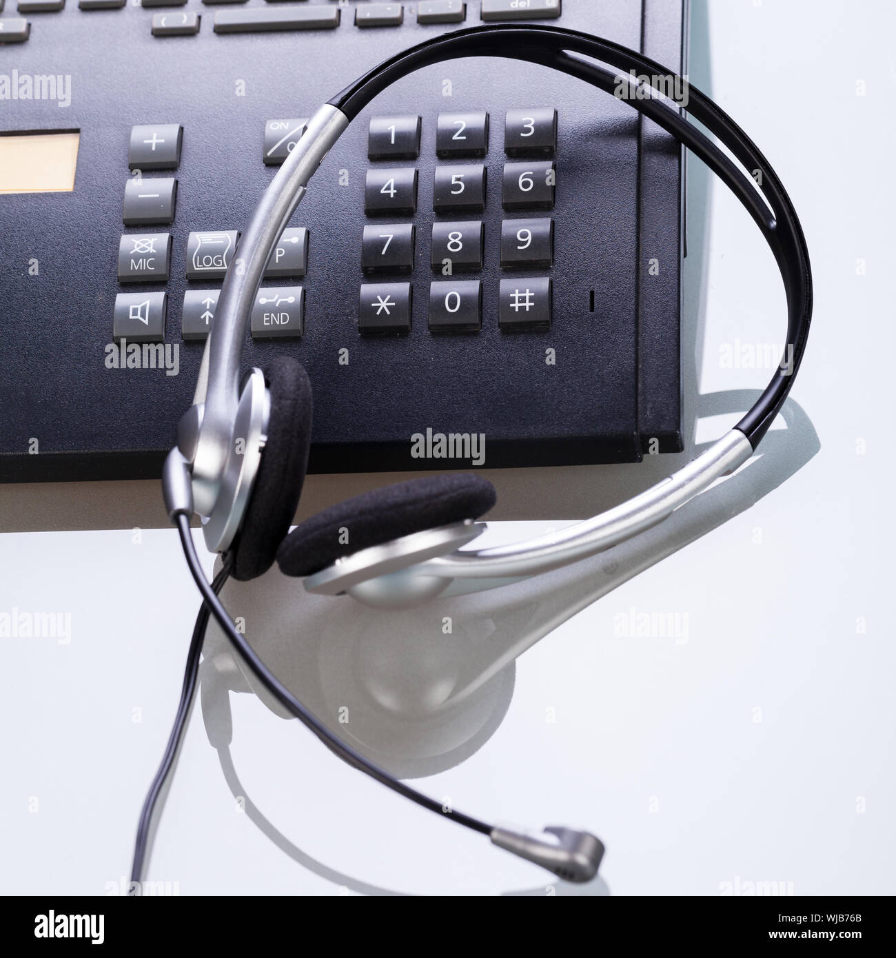 office desk with telephone and headset objects Stock Photo Alamy