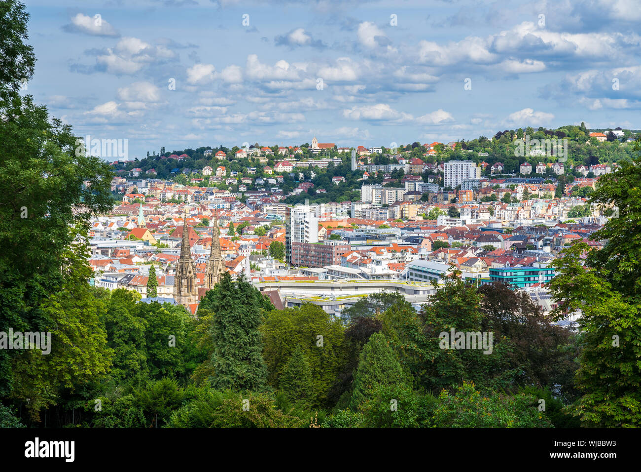 Germany, Downtown stuttgart houses and churches seen from above green ...
