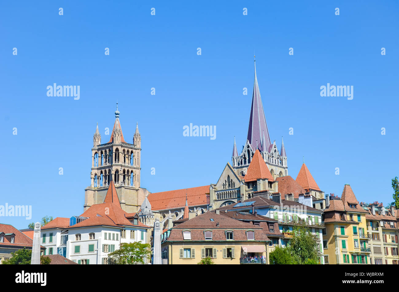 The tower of the Cathedral of Notre Dame in Lausanne, Switzerland. Located in canton Vaud. It belongs to the Evangelical Reformed Church. Religious buildings. Gothic architecture. Religion. Stock Photo