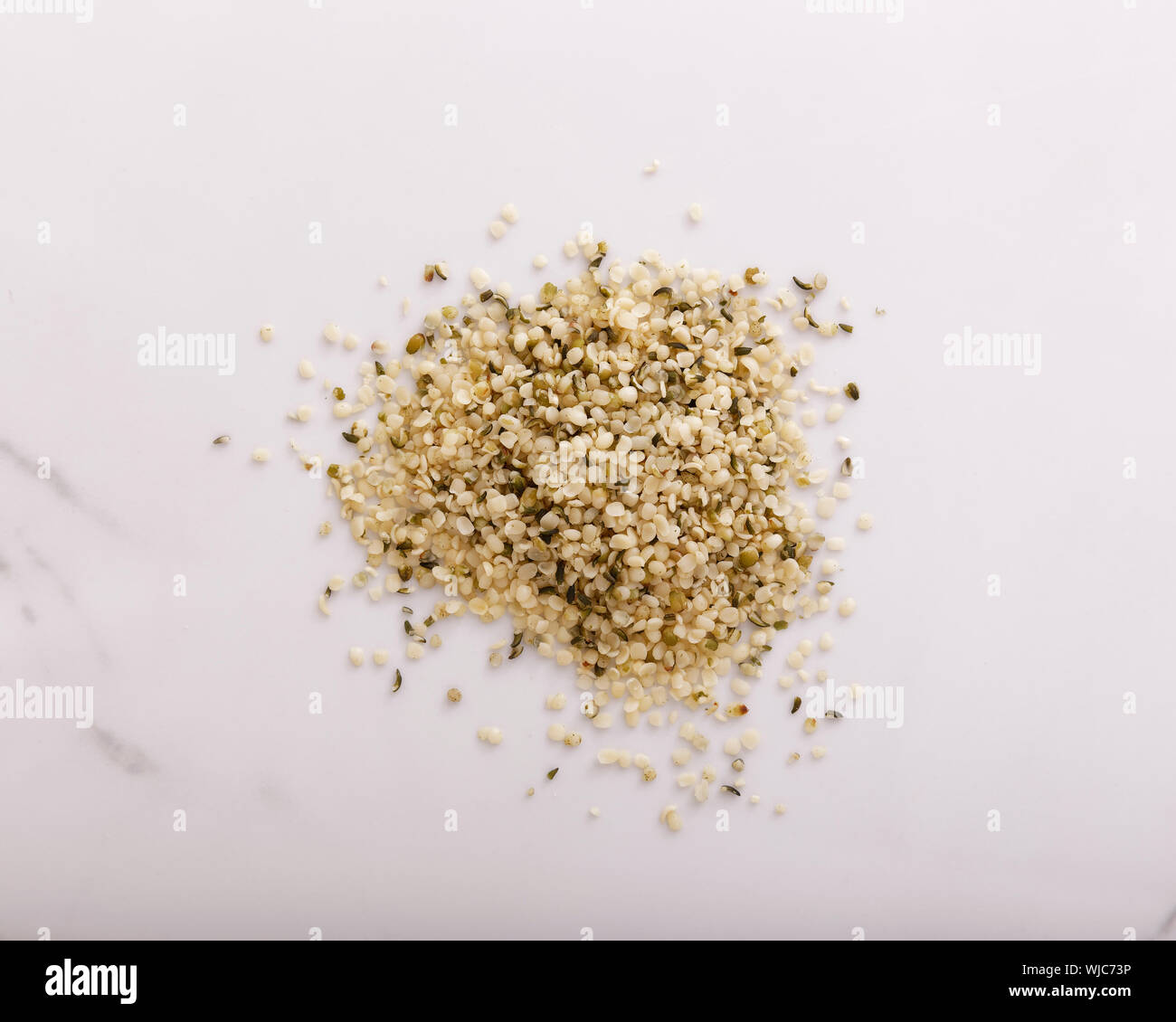 Hemp seeds piled and seen from above Stock Photo