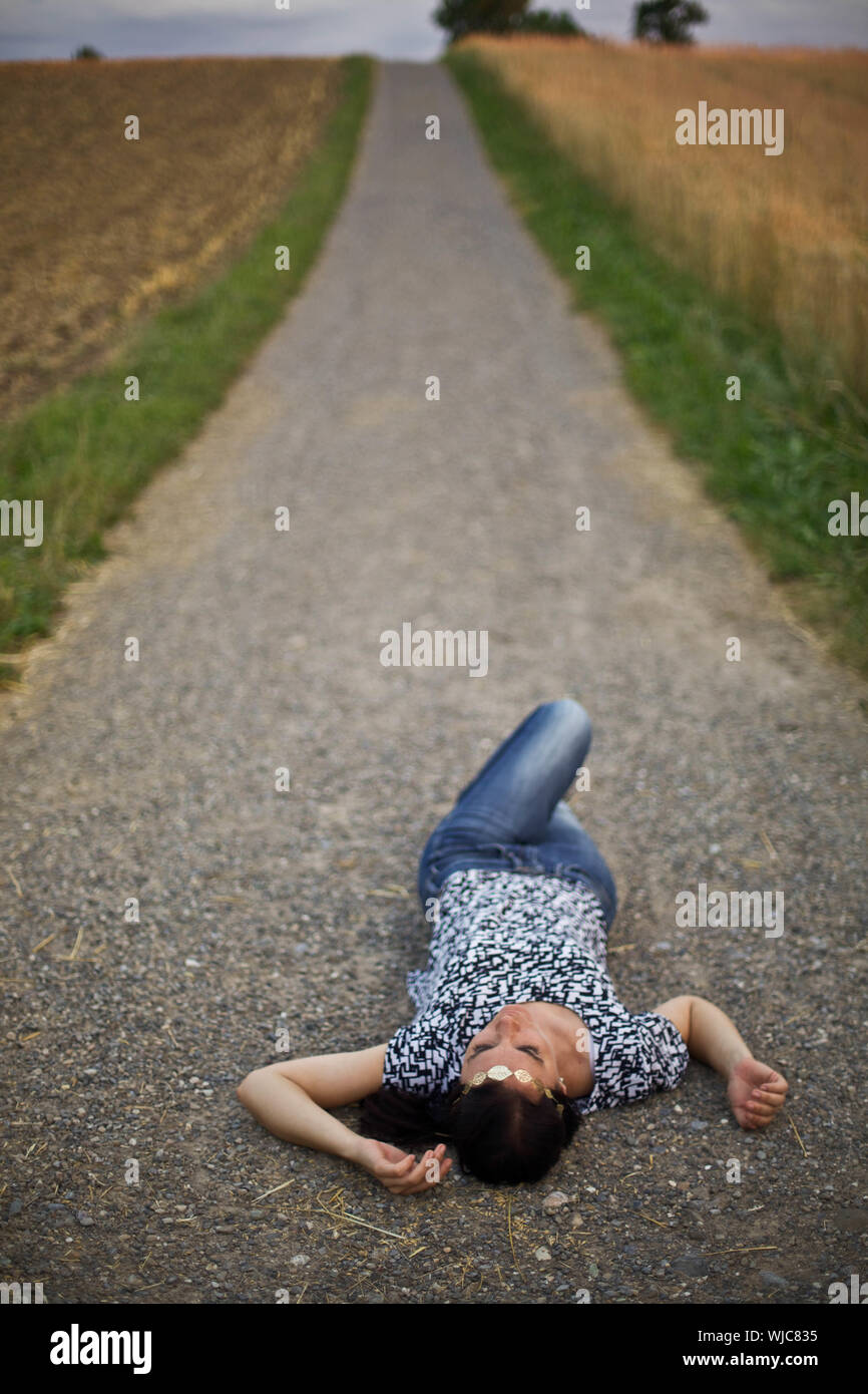 Woman lying in desert hi-res stock photography and images - Alamy