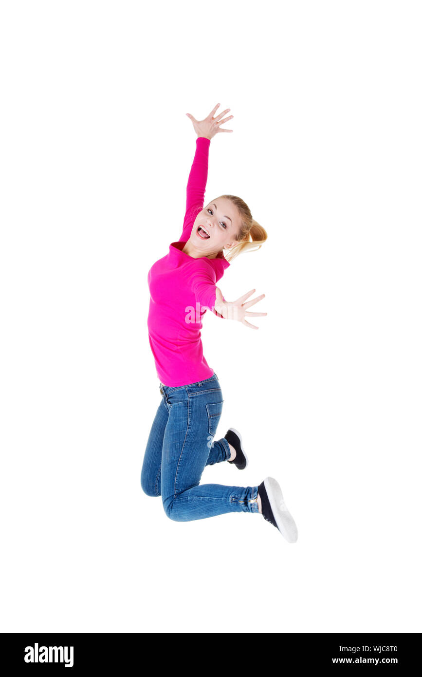 Young caucassian woman is jumping. Isolated on white. Stock Photo