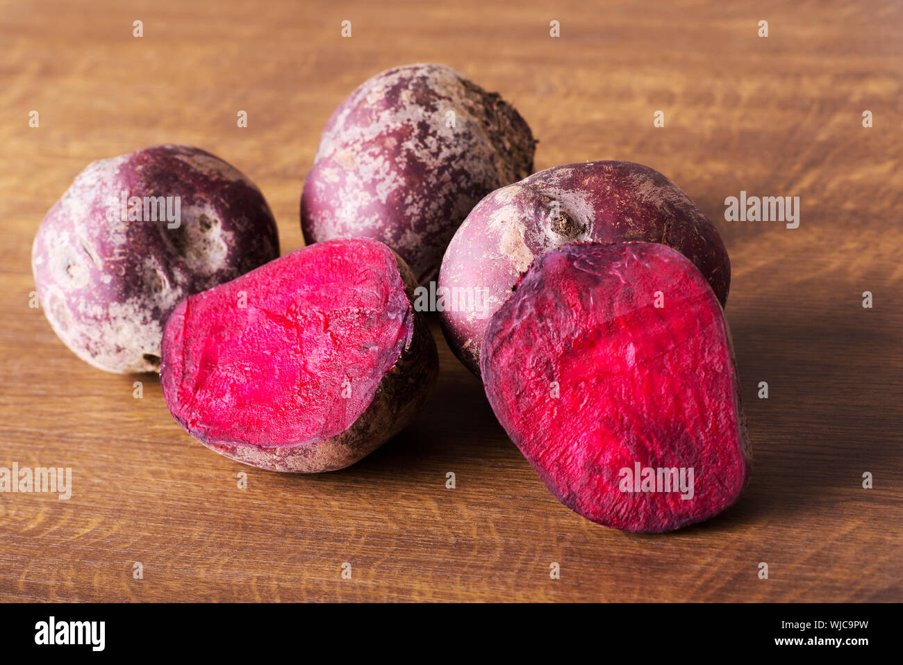 fresh, raw Beetroots over wooden background. Stock Photo