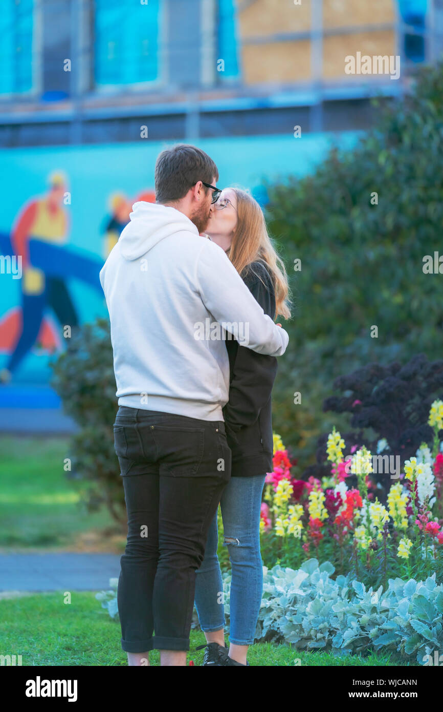 Young couple outdoors kissing, Mennigarnott or Cultural day, Reykjavik, Iceland. Stock Photo