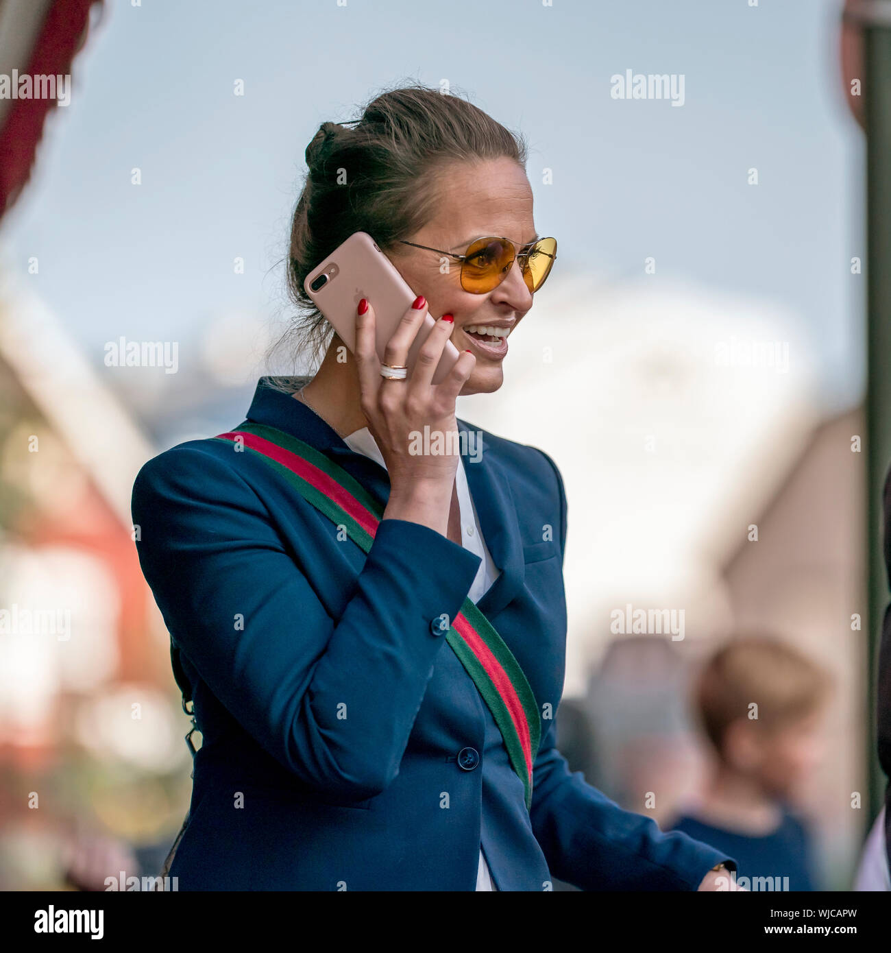 Woman using a smart phone, Menningarnott or Cultural day, Reykjavik, Iceland Stock Photo