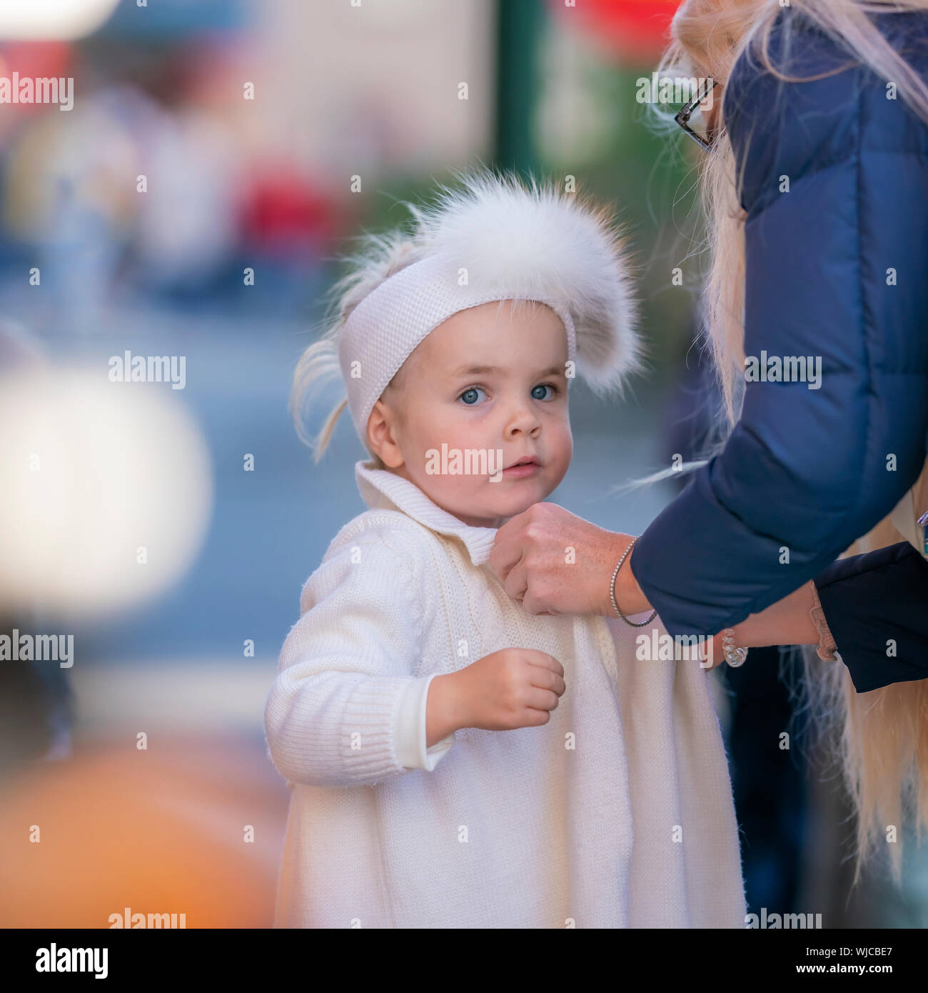 Young girl wearing a sweater and hat, Menningarnott or Cultural day, Reykjavik, Iceland Stock Photo
