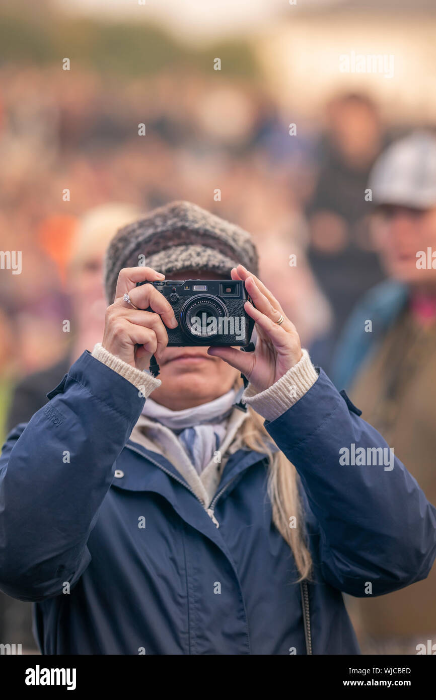 Woman taking a picture, street scene, Menningarnott or Cultural day, Reykjavik, Iceland Stock Photo