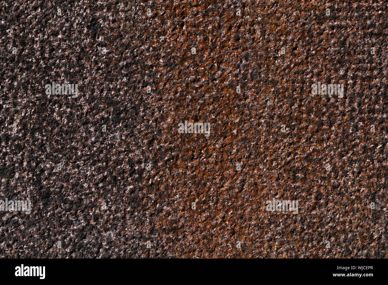 hammered granite background in black and red. Stock Photo