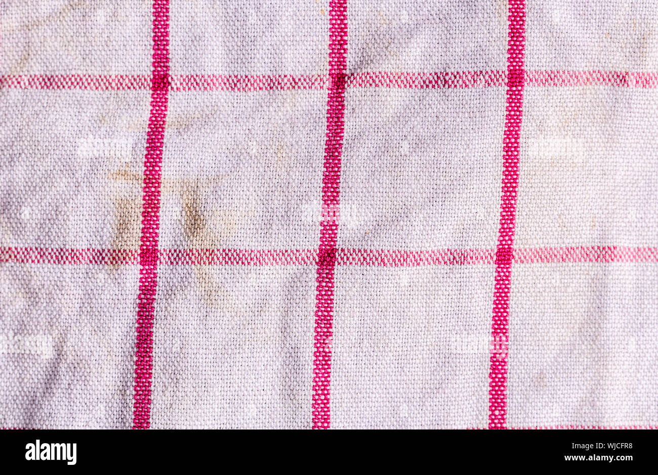 closeup of a white towel with red lines, background texture. Stock Photo