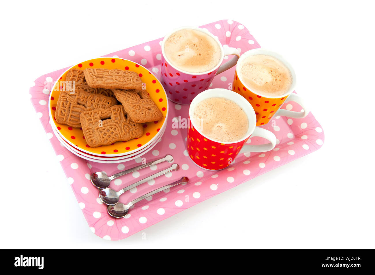 speckles cups and saucers with cookies isolated over white Stock Photo
