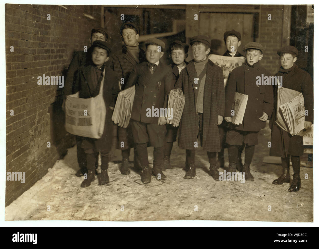 Hartford, Conn. 6 A.M. Sunday. See photo and label 602 Caption #602: 6:00 A.M. Sunday, March 7, 1909. Boys starting out with Sunday papers. Some were only 8 and 9 years old. Many more youngsters start out at 7 A.M. Some of these little fellows had been selling until 7 and 8 P.M. and later Saturday night. and 664 #664: 8,9 and 10 years old starting out at 6 A.M. Sunday. Abstract: Photographs from the records of the National Child Labor Committee (U.S.) Stock Photo