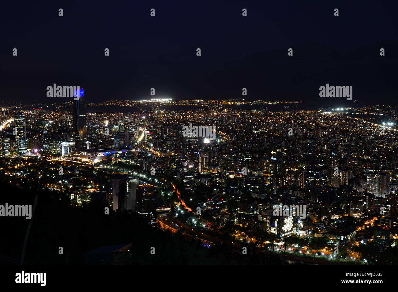 Illuminated Cityscape Against Sky At Night Stock Photo